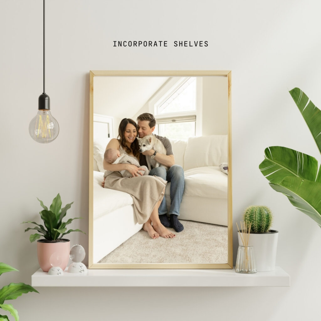 Shelf with framed photo of newborn with parents and dog on couch on a shelf with plants surrounding