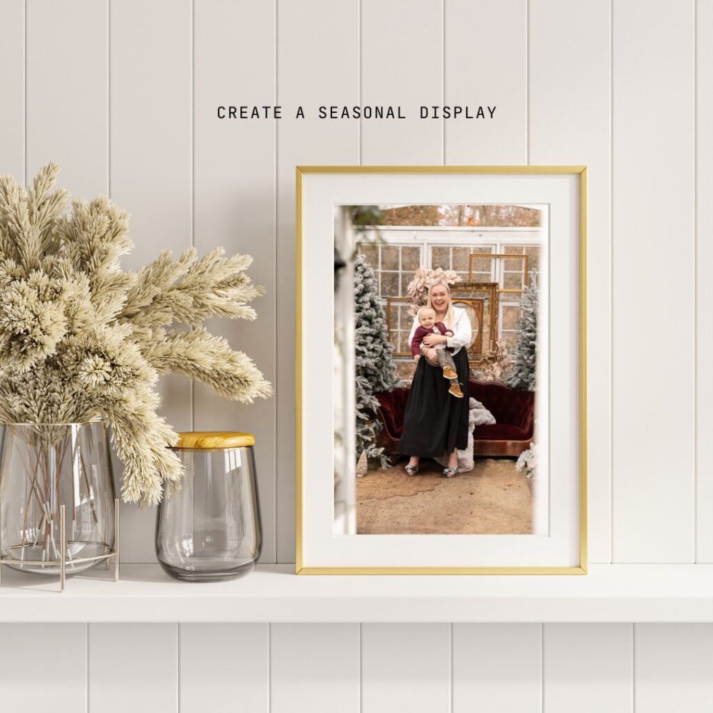 elegant framed photo of mother with baby dressed for christmas sits on a shelf with simple decorations