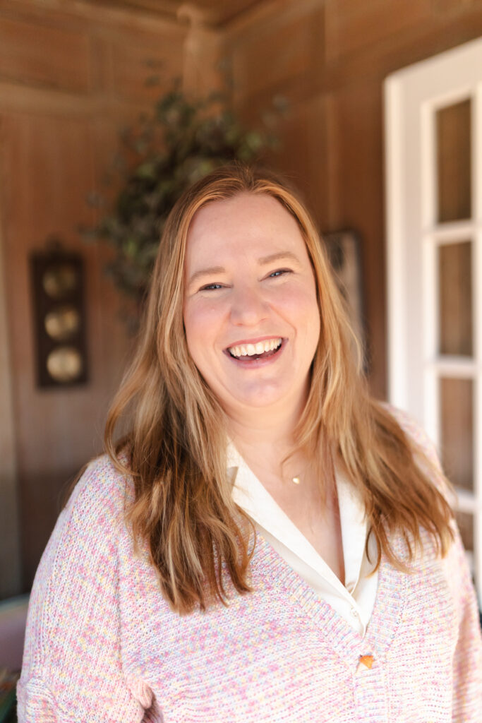 woman's headshot in wood paneled home office